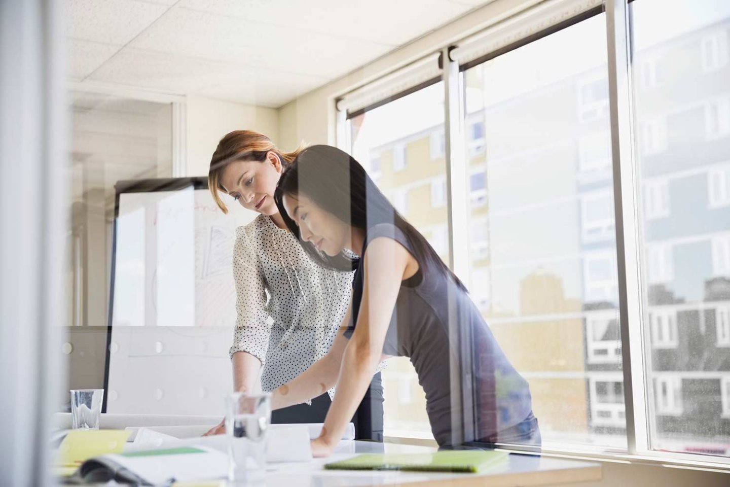 Businesswomen working on project together in office