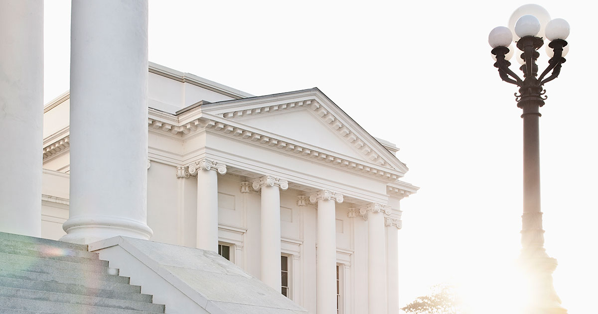 Businessmen sitting on steps talking, courthouse, government, legislative, two men, man