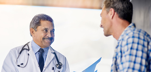 Shot of a mature doctor giving his patient feedback during a consult