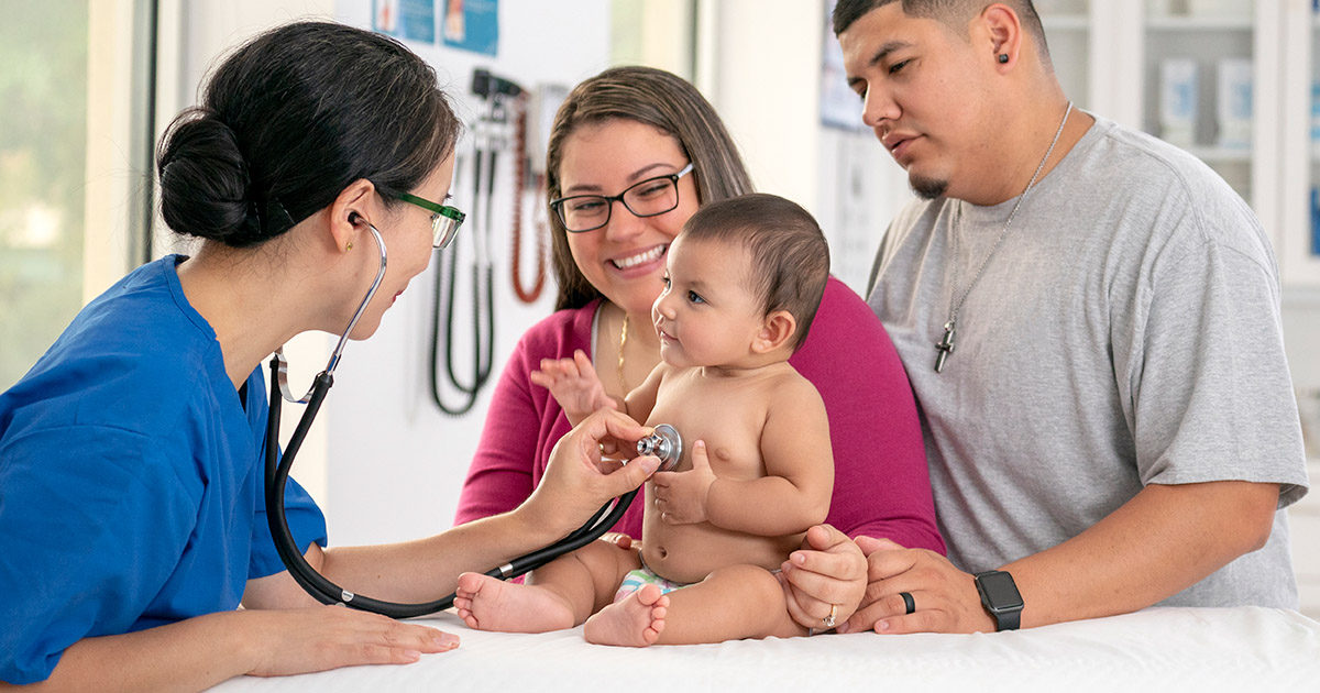 Baby getting check-up by doctor, child, medical, clinic