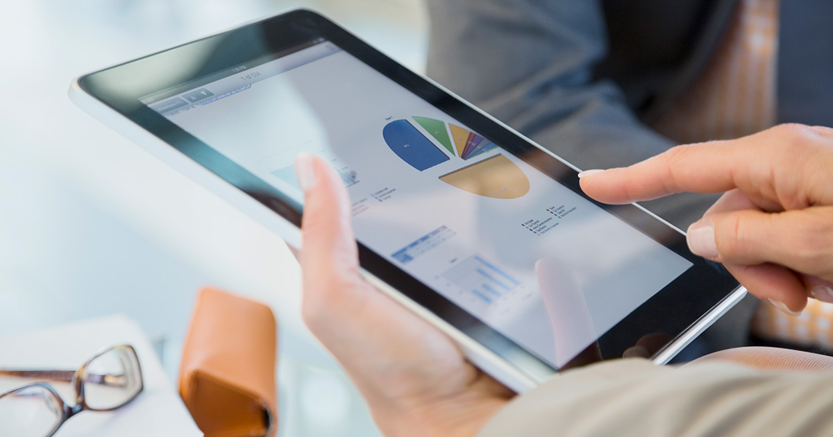 Businesspeople reviewing financial data on digital tablet, device, glasses, point, hands