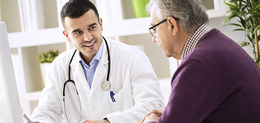 Doctor explaining prescription to senior patient, healthcare concept