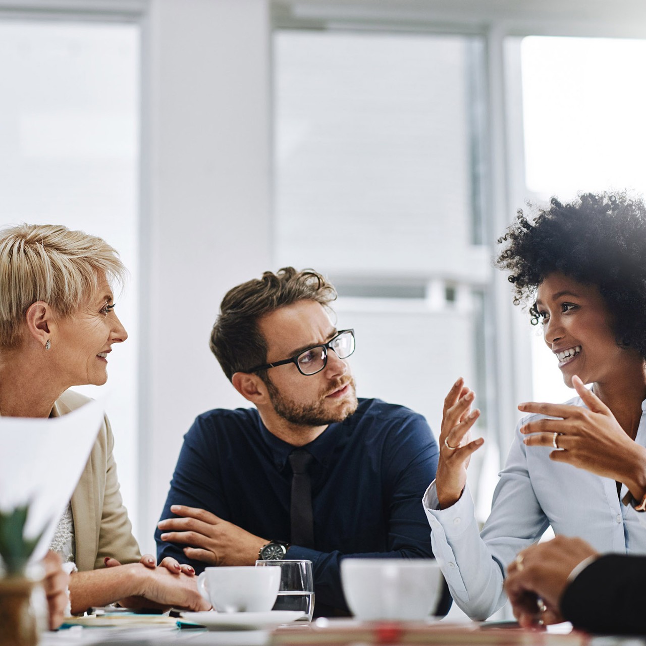 Shot of a group of businesspeople sitting together in a meeting