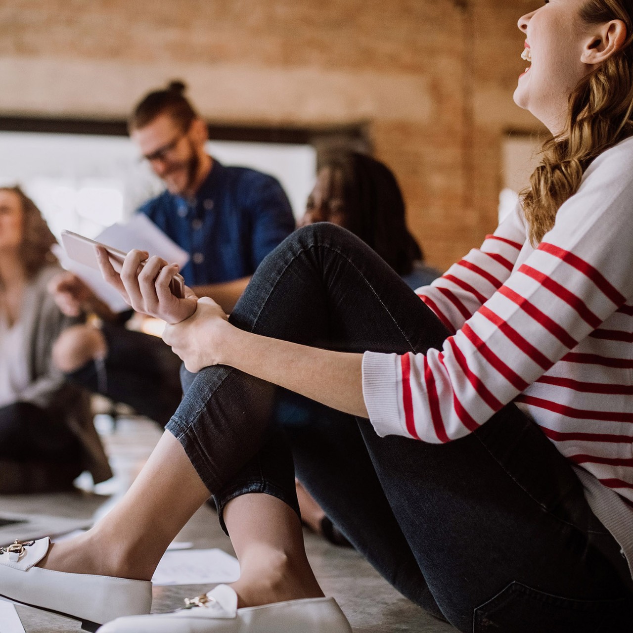 Group Of People Going Through Paperwork At the Office