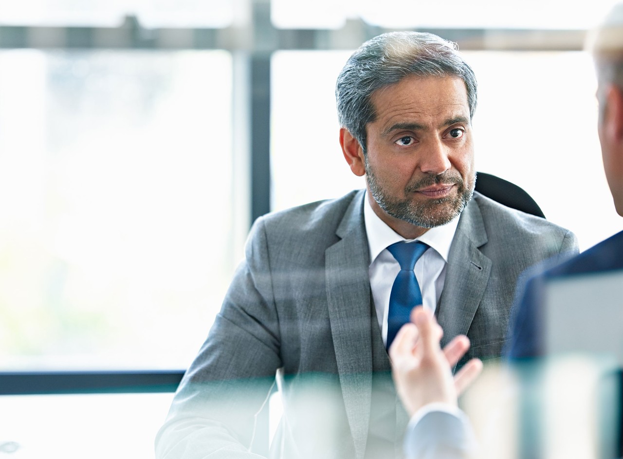 Senior businessman in discussion with client