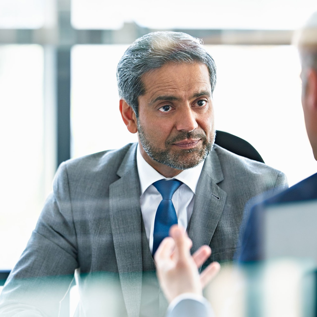 Senior businessman in discussion with client