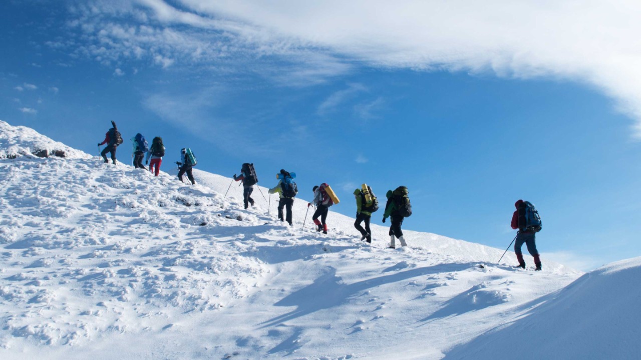hikers in a winter mountain