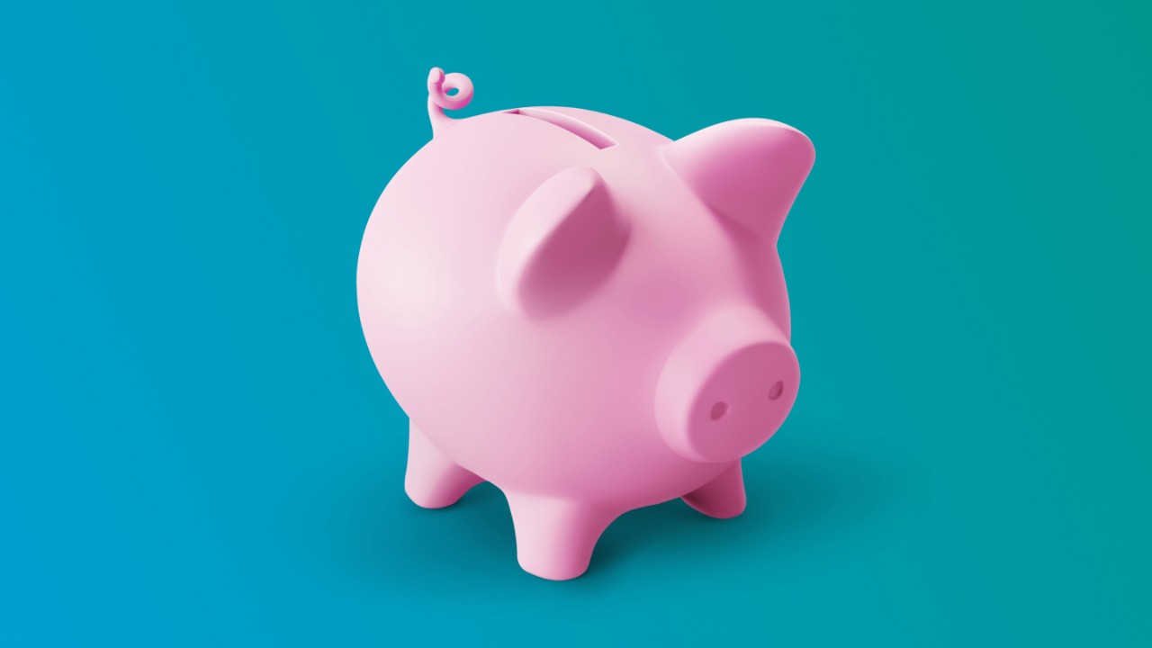A pink piggy bank on a gradient background.