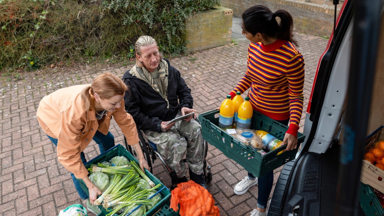  They are working together, passing the food back and forth.