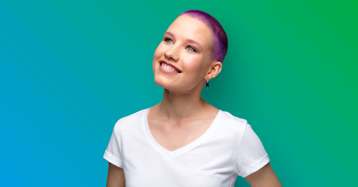 Smiling women with very short haircut dyed purple wearing  white t-shirt - blue to green gradient