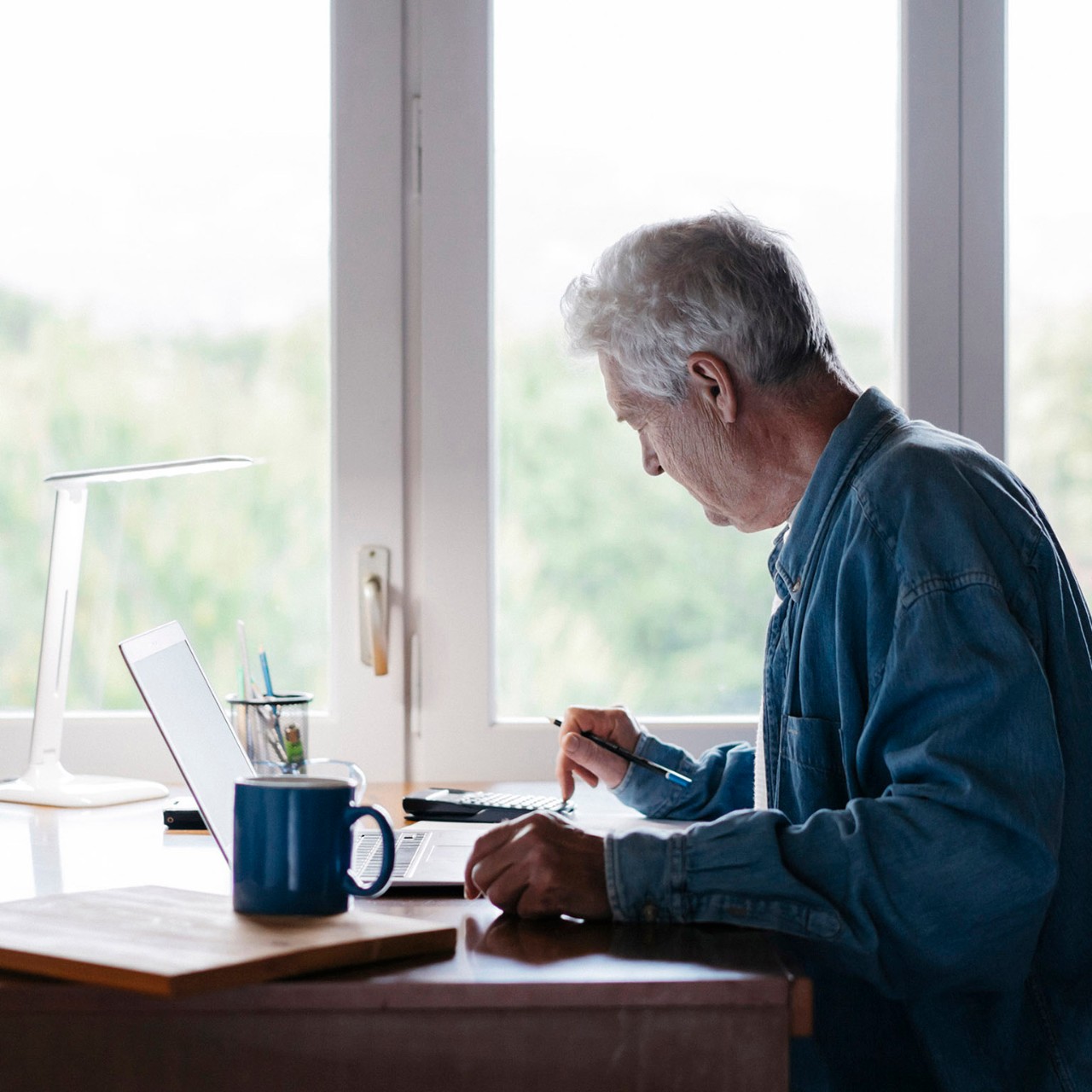 Barcelona, Spain. Senior man working from home. Senior, home, free time, retired, jubilee, job, home office, hobbie, enjoy, free time, pet, cat,