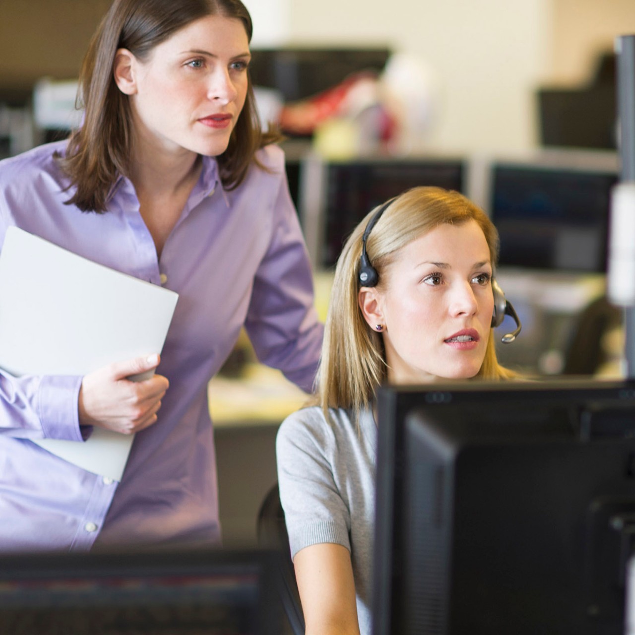 Businesswoman using digital tablet at office desk