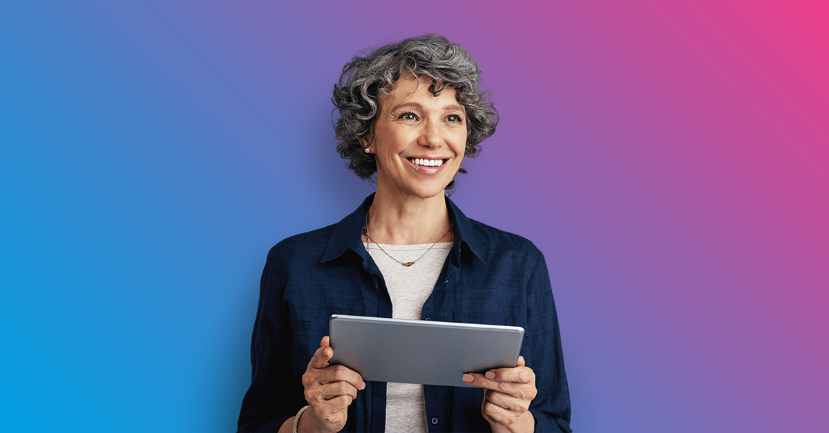 Woman holding a tablet and smiling