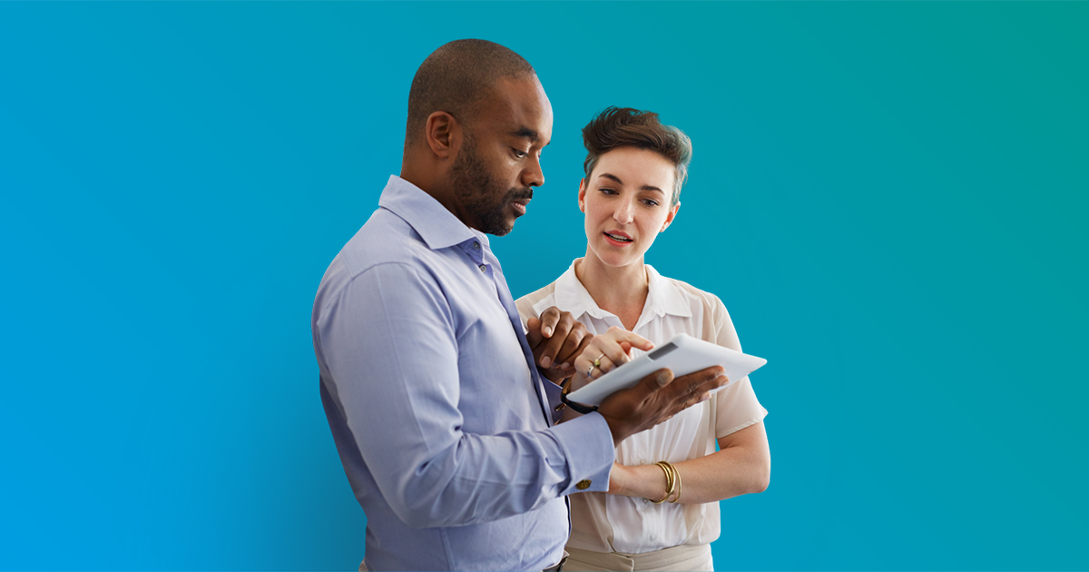 Man and woman looking at tablet  - turquoise gradient