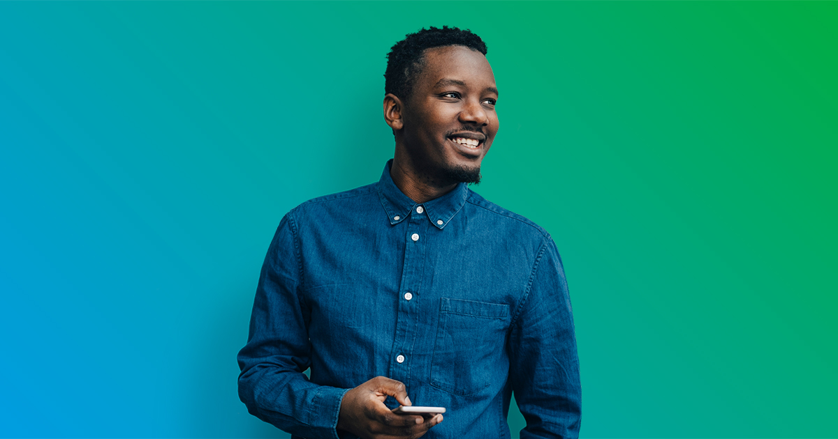 Smiling man holding cell phone - blue to green gradient