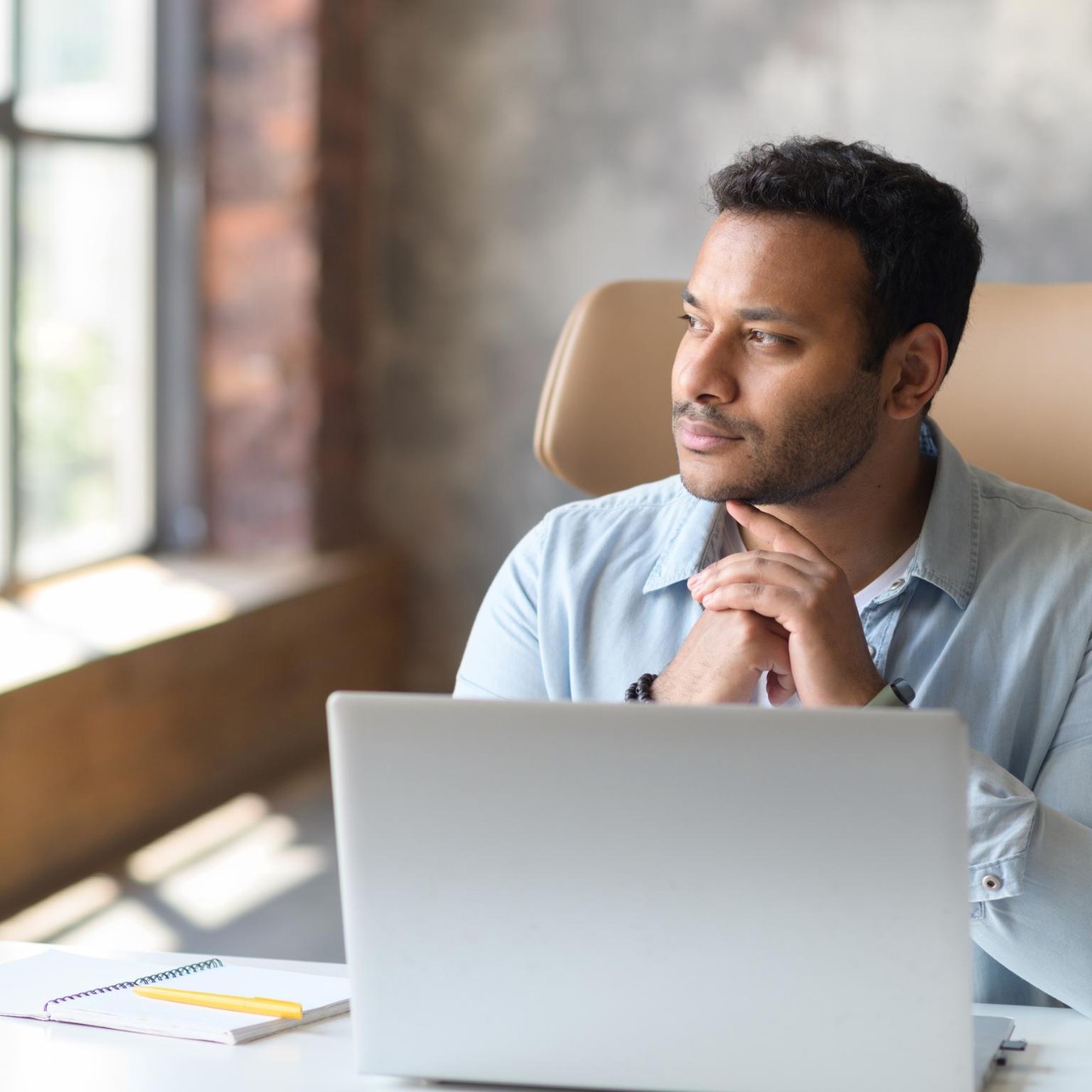 Young male concentrated laptop working