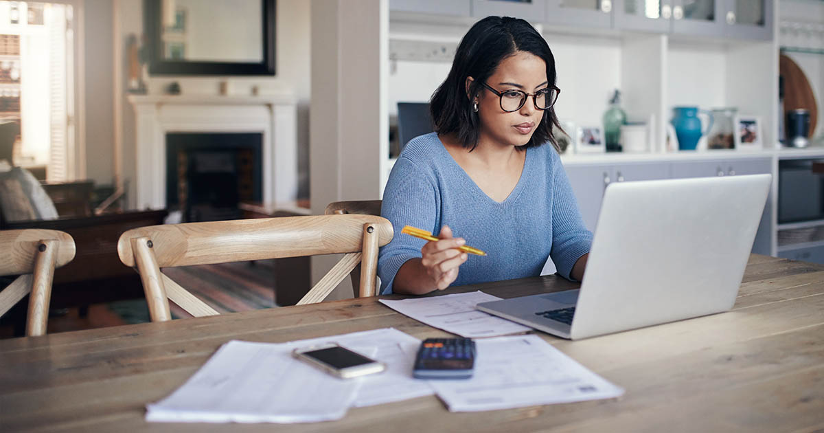 Woman using a laptop while working from home