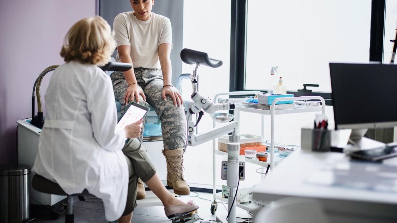 A female soldier is being examined by a gynecologist