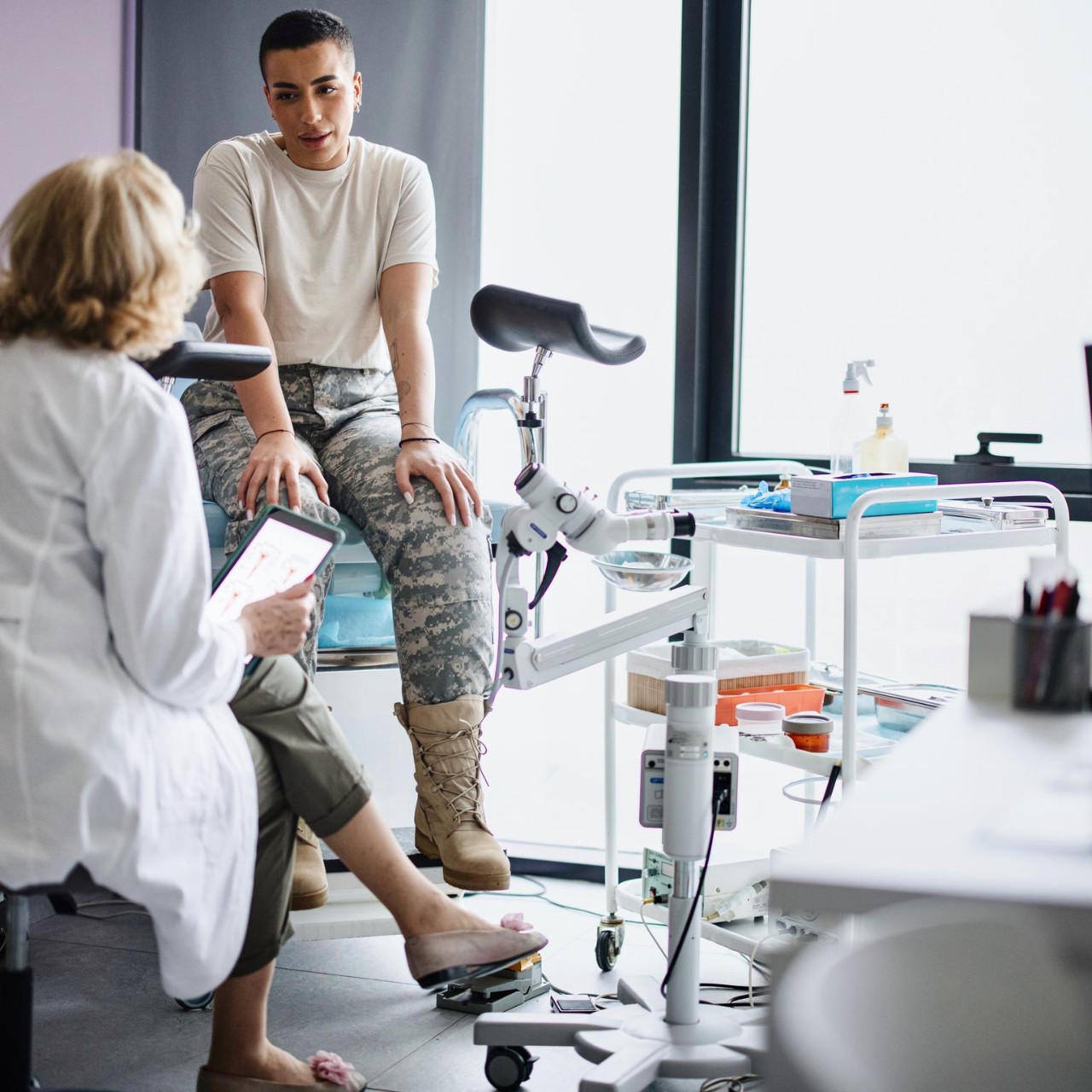 A female soldier is being examined by a gynecologist