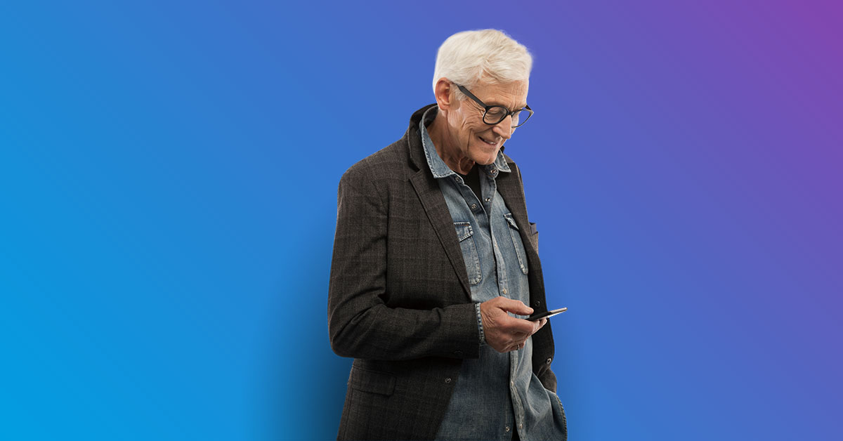 Senior man looking down at phone smiling - blue to purple gradient