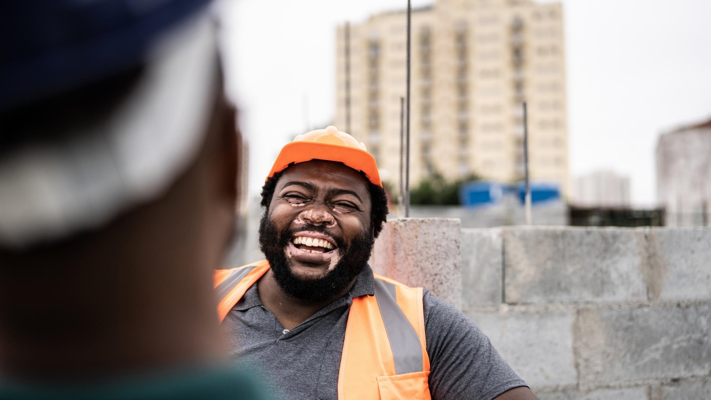  Coworkers talking in a construction site