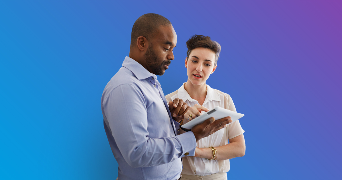 Woman pointing to tablet  man is holding and both are looking at - blue to purple gradient