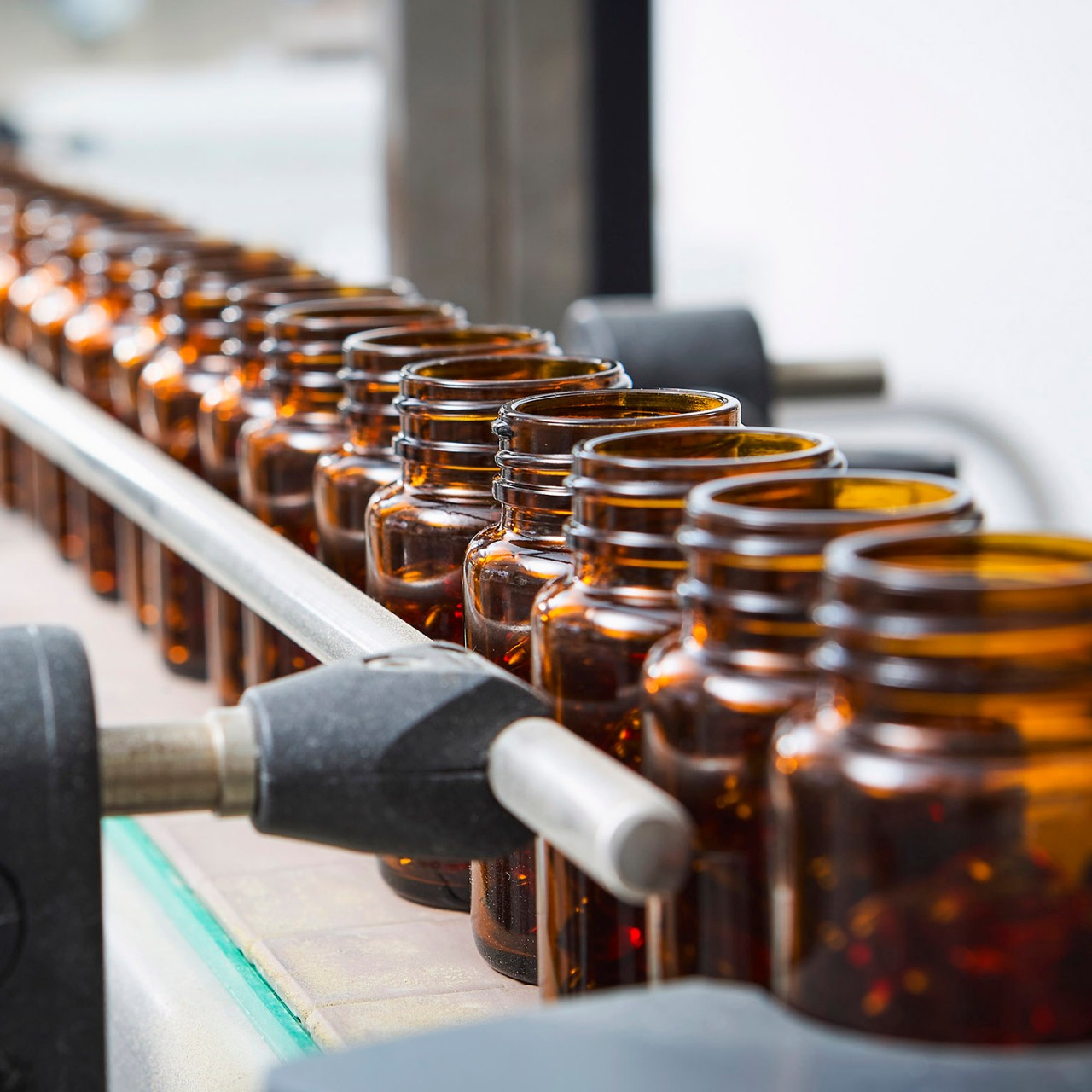 pill bottles on conveyer belt