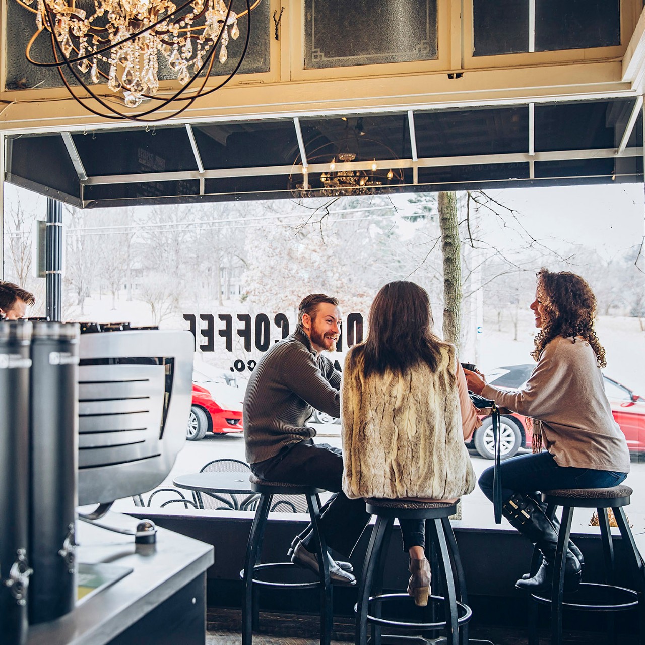 Friends drinking coffee in cafe