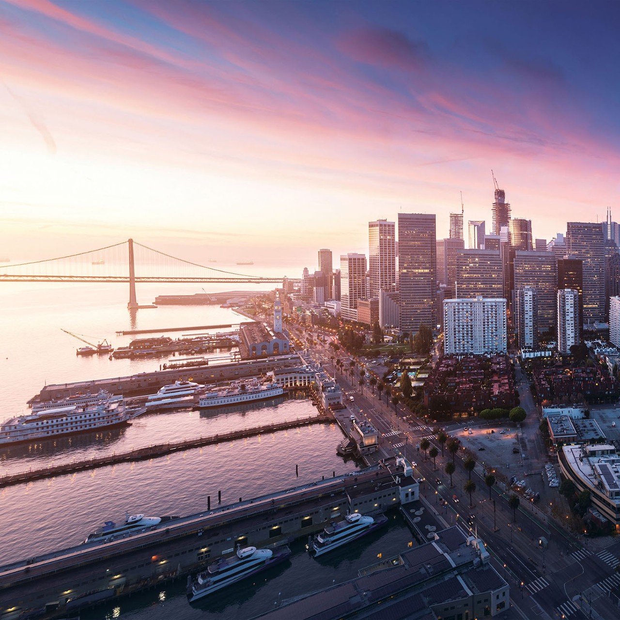 San Francisco panorama at sunrise with waterfront and downtown. California theme background. Art photograph.