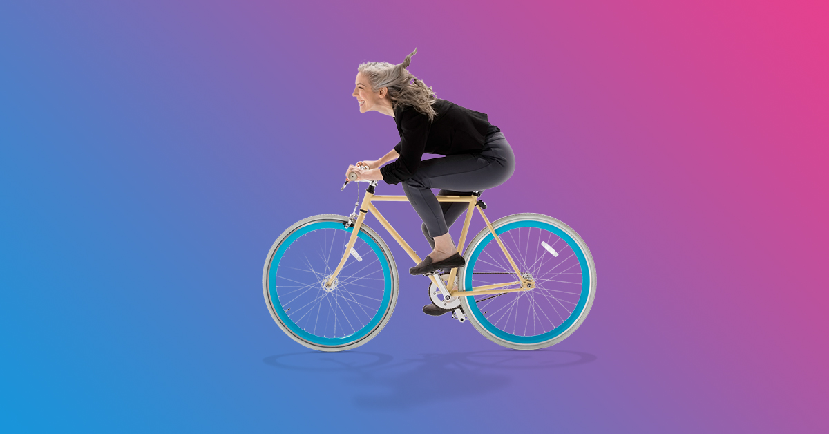 Cutout of a smiling woman on a bicycle
