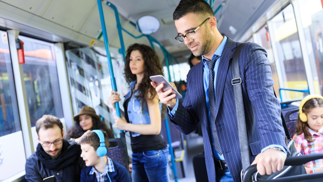 Cutout of a smiling woman on a bicycle