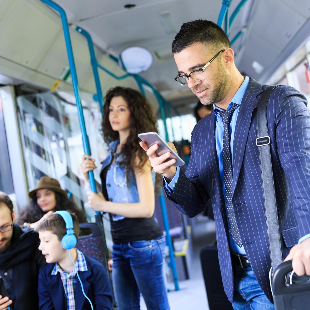 Businessman traveling and using smart phone.