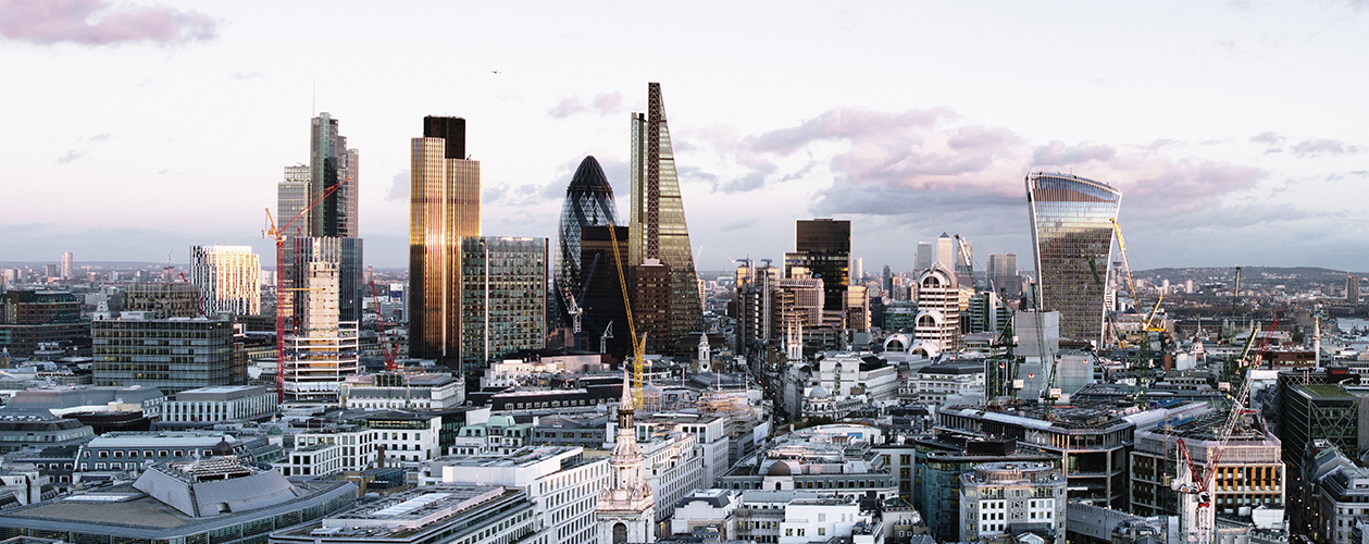 Elevated view over London city skyline at sunset, buildings, sky UK: New Remuneration Reporting Rules To Apply to UK Listed Companies