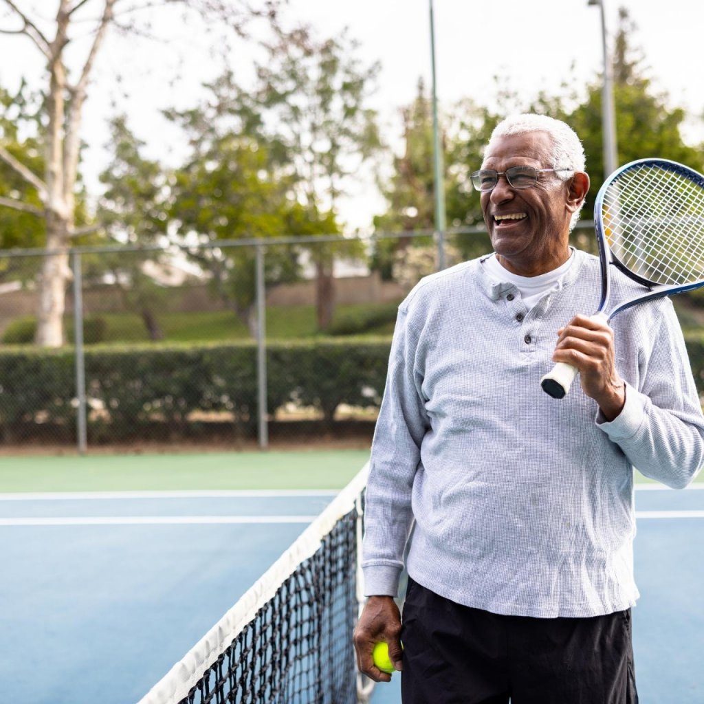 A senior black man smiling