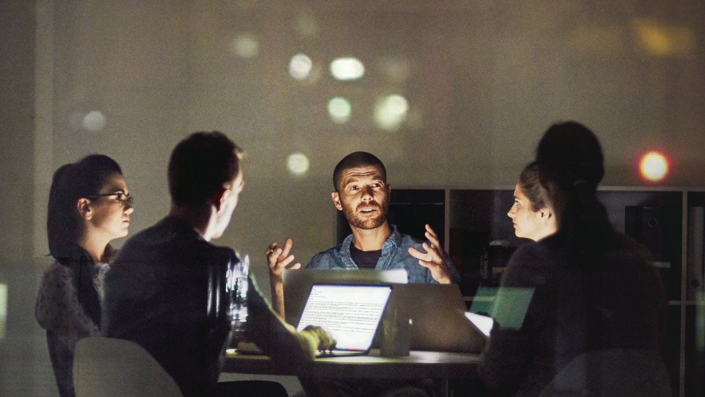  Shot of creative employees working late in the office