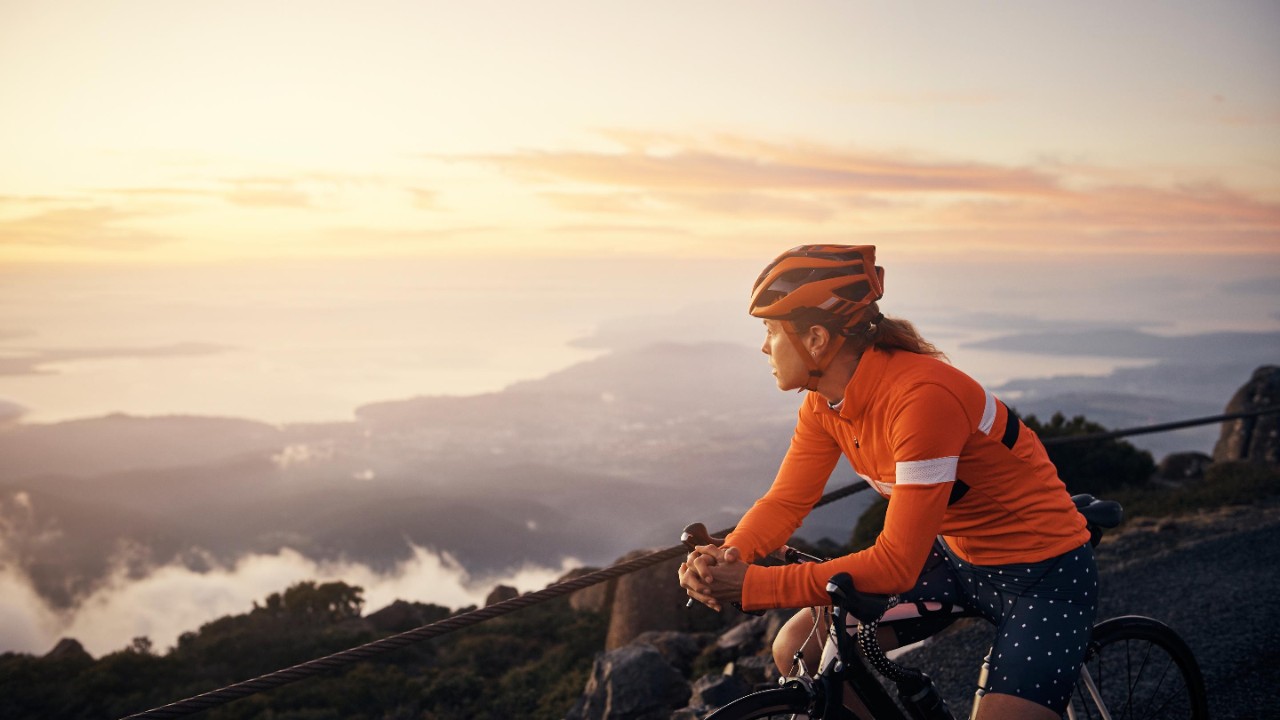 Young woman cycling in the mountains