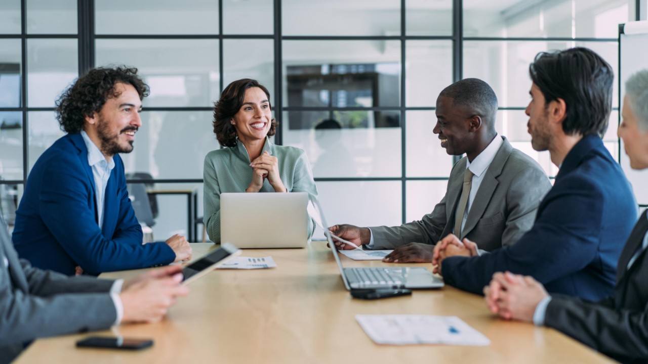 Group of business persons in business meeting. Group of entrepreneurs on meeting in board room. Corporate business team on meeting in the office.