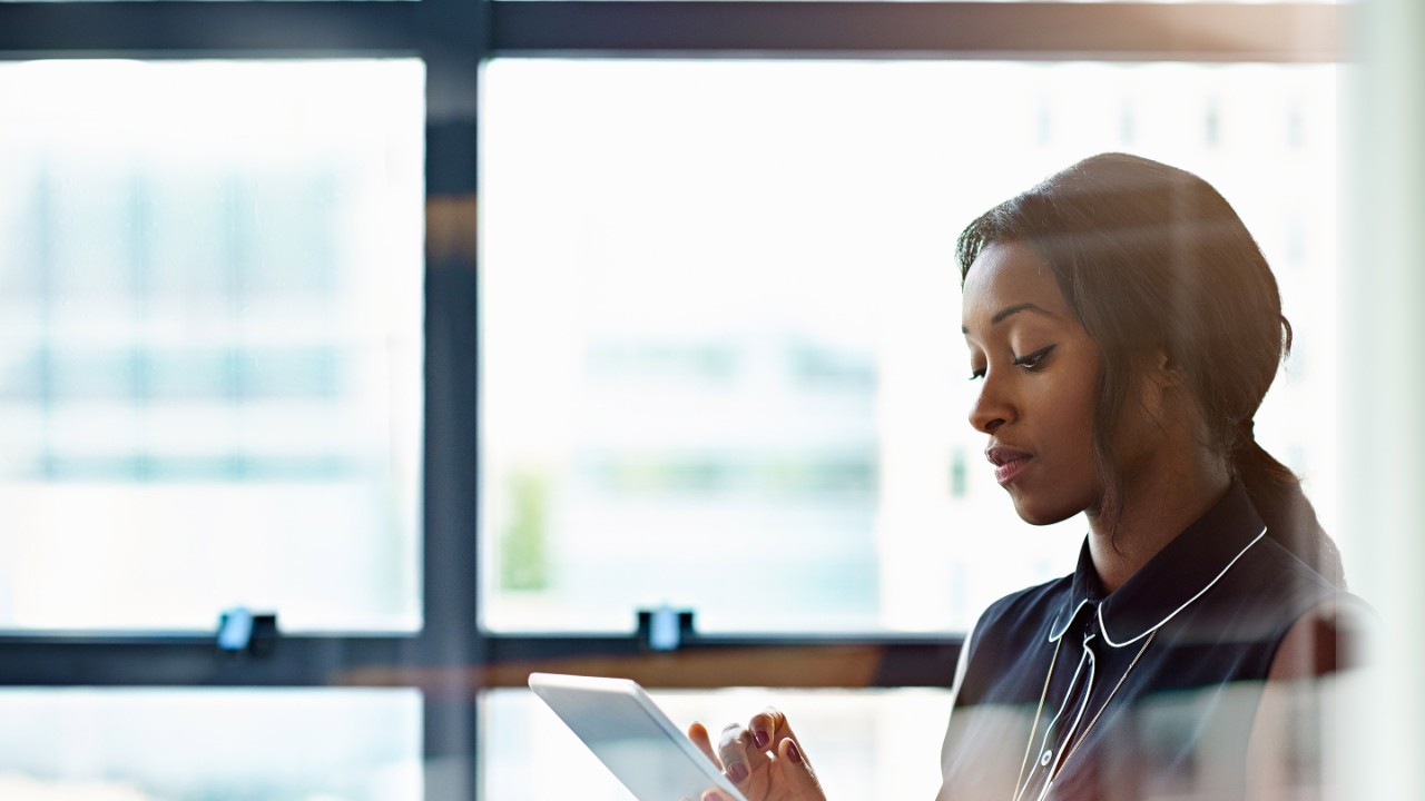 Businesswoman using a digital tablet in office