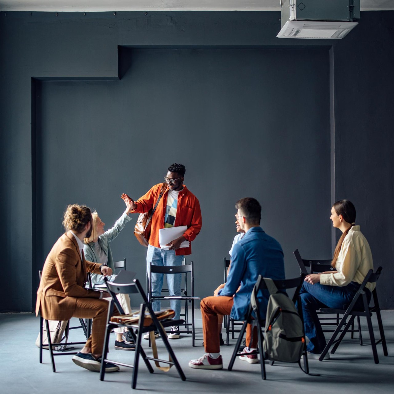 Coworkers congratulating each other