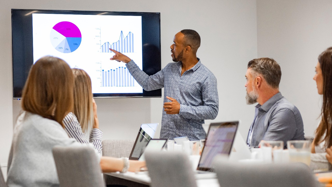 Businessman giving presentation with colleagues